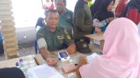 Anggota Koramil 05/Kelapa Kampit Hadiri Pelaksanaan Gerakan Masyarakat Hidup Sehat 